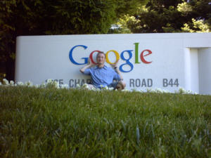 Thomas holding the Google logo