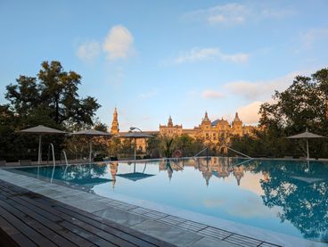 View of the hotel pool with the Glorieta De La Ronda De Capitania in the background.